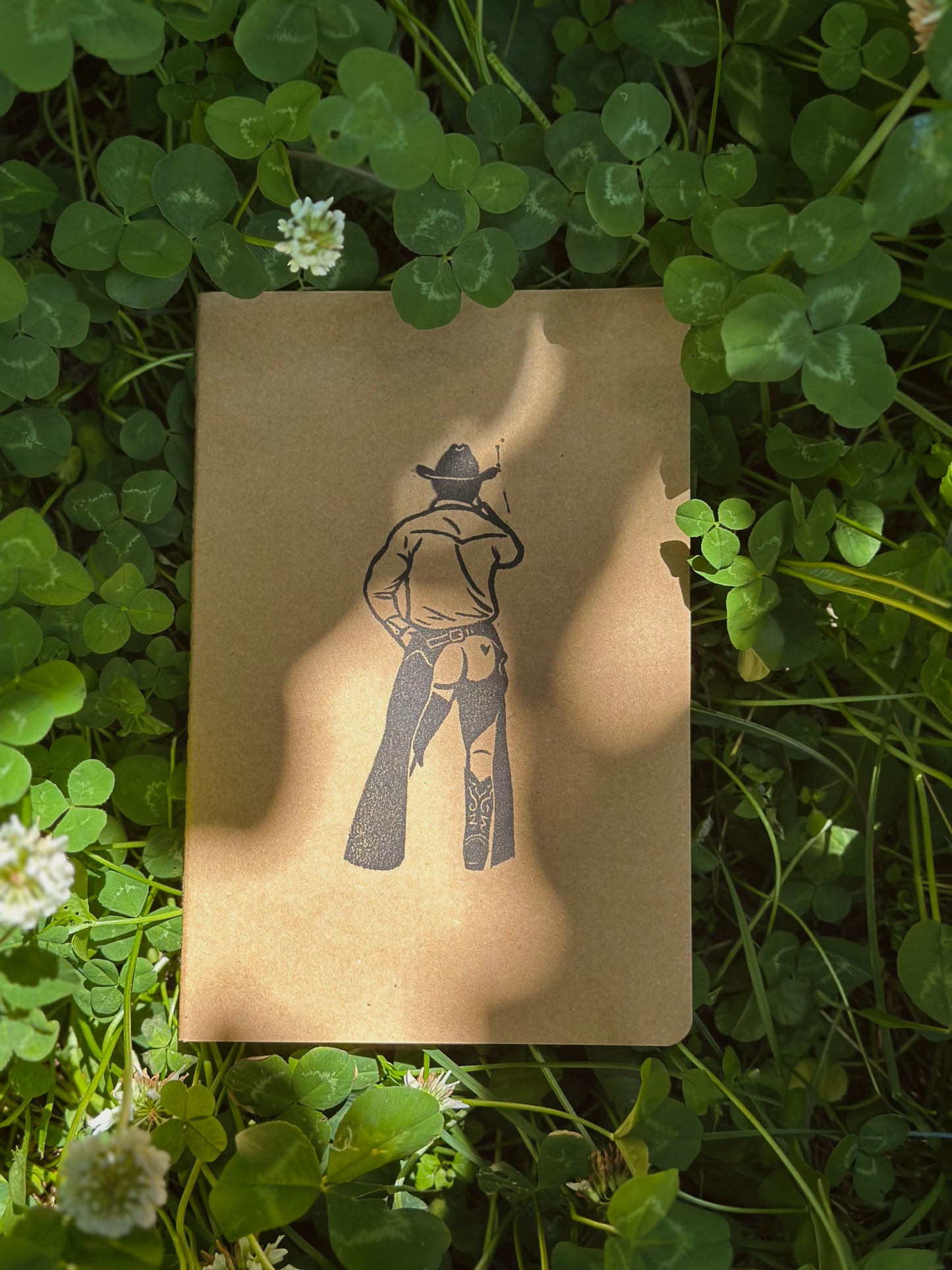 cheeky cowboy linoprinted sketchbook