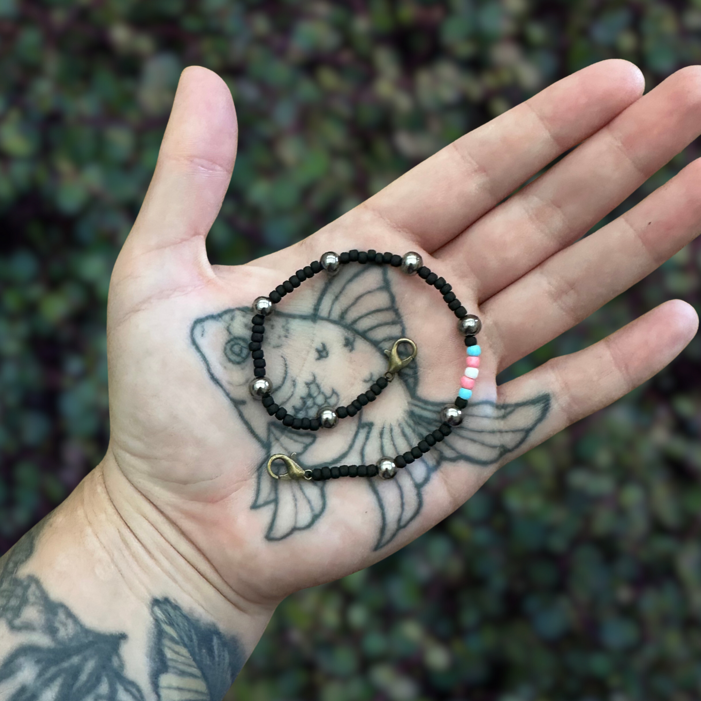 black mask chain with trans flag