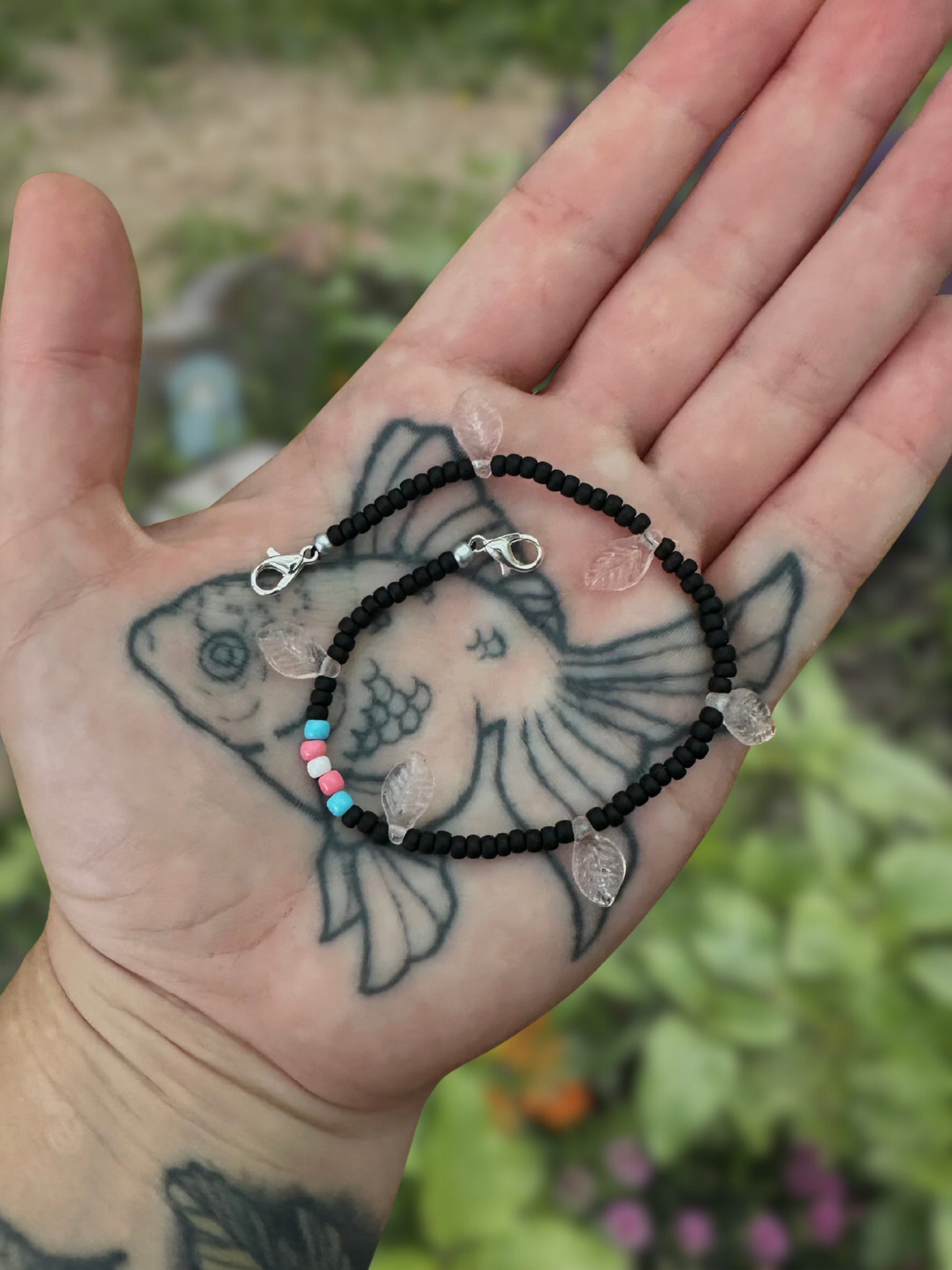 black with trans flag beaded mask chain with pinkish leaves