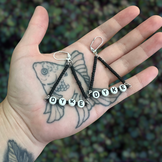 dyke triangle earrings with black beads