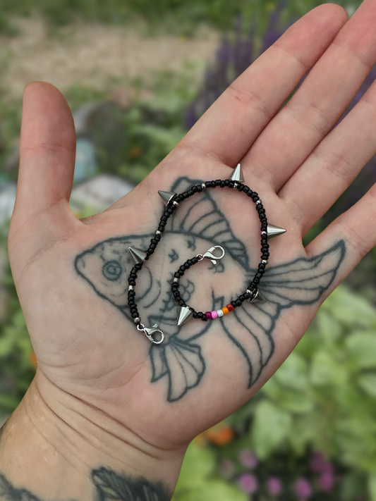 spikey black lesbian flag beaded mask chain