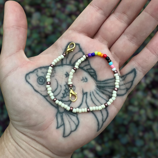stone beaded mask chain with progressive pride flag