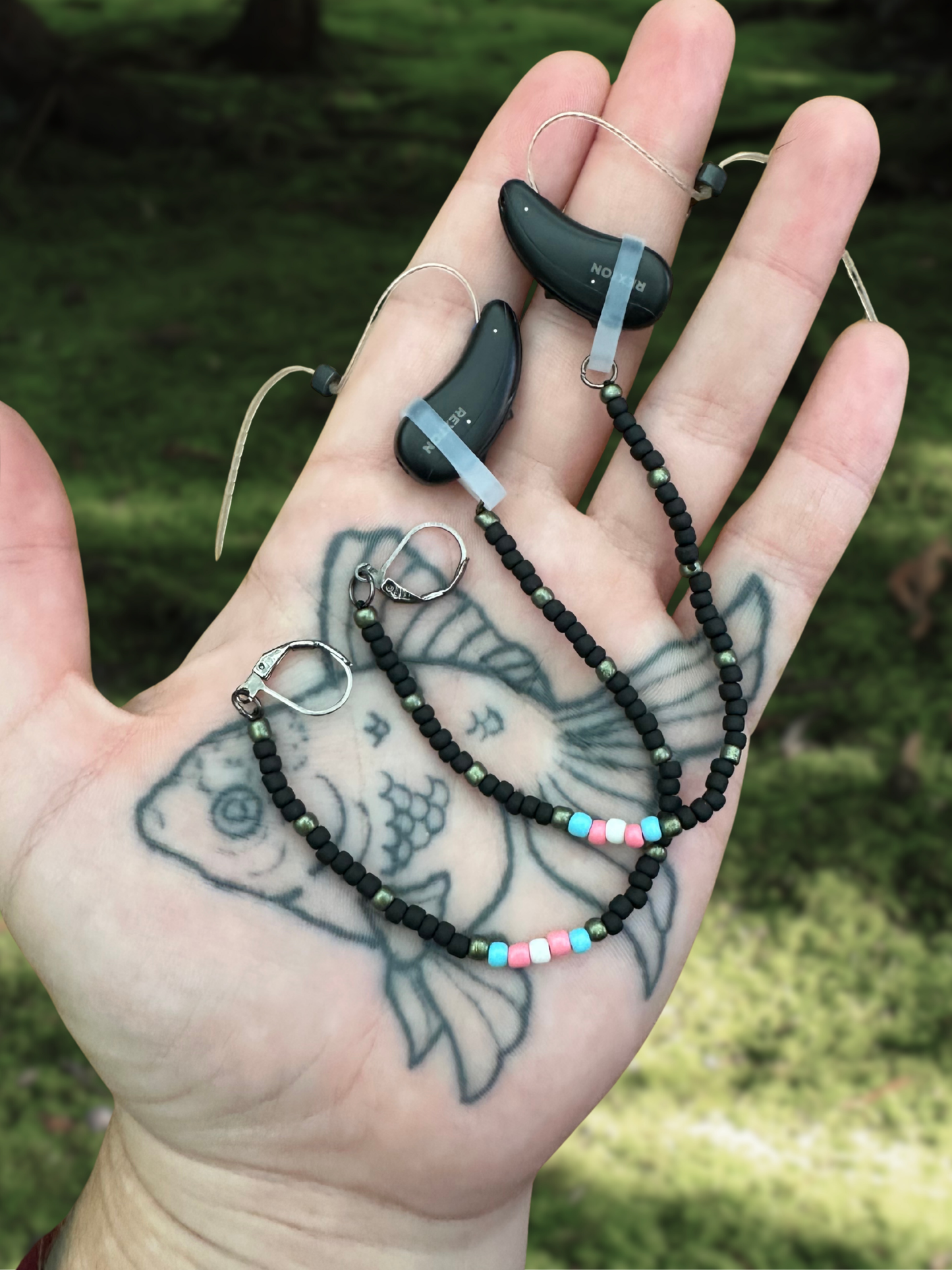 black & trans beaded hearing aid savers