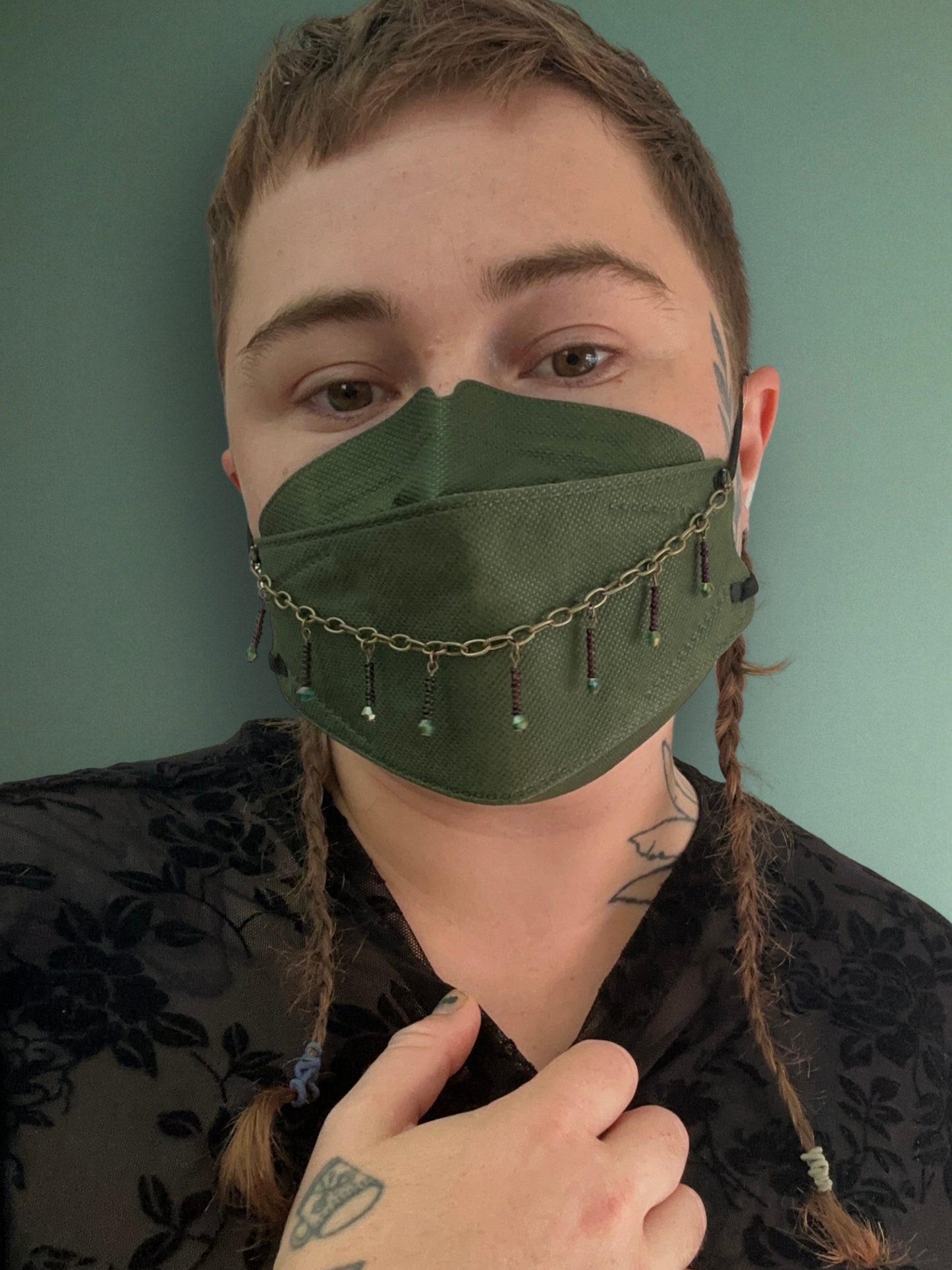 antique style mask chain with green sparkles