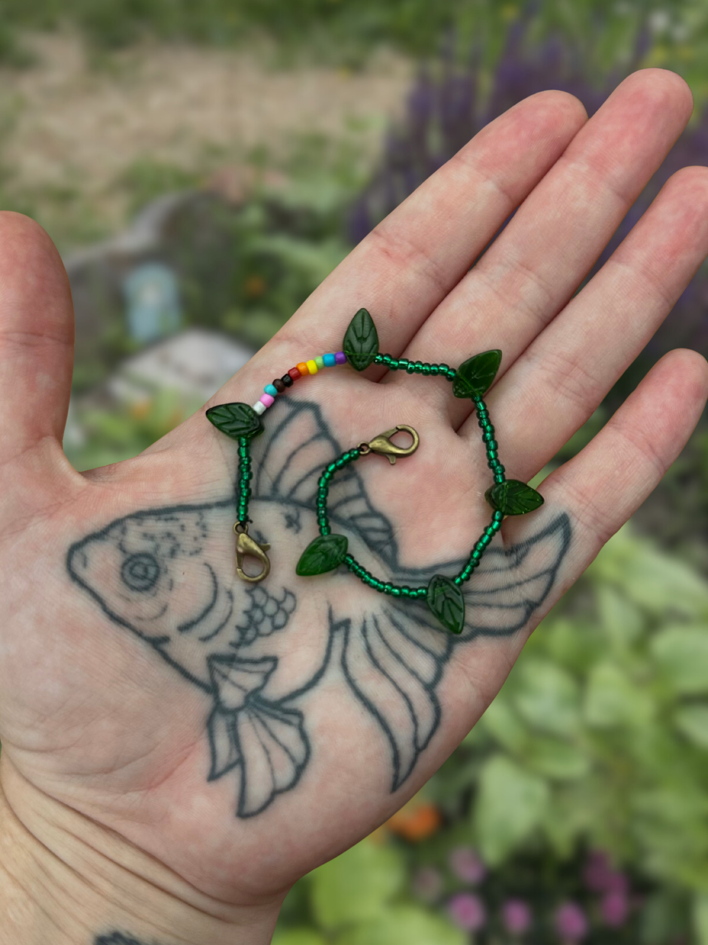 nature queer mask chain with progressive pride flag