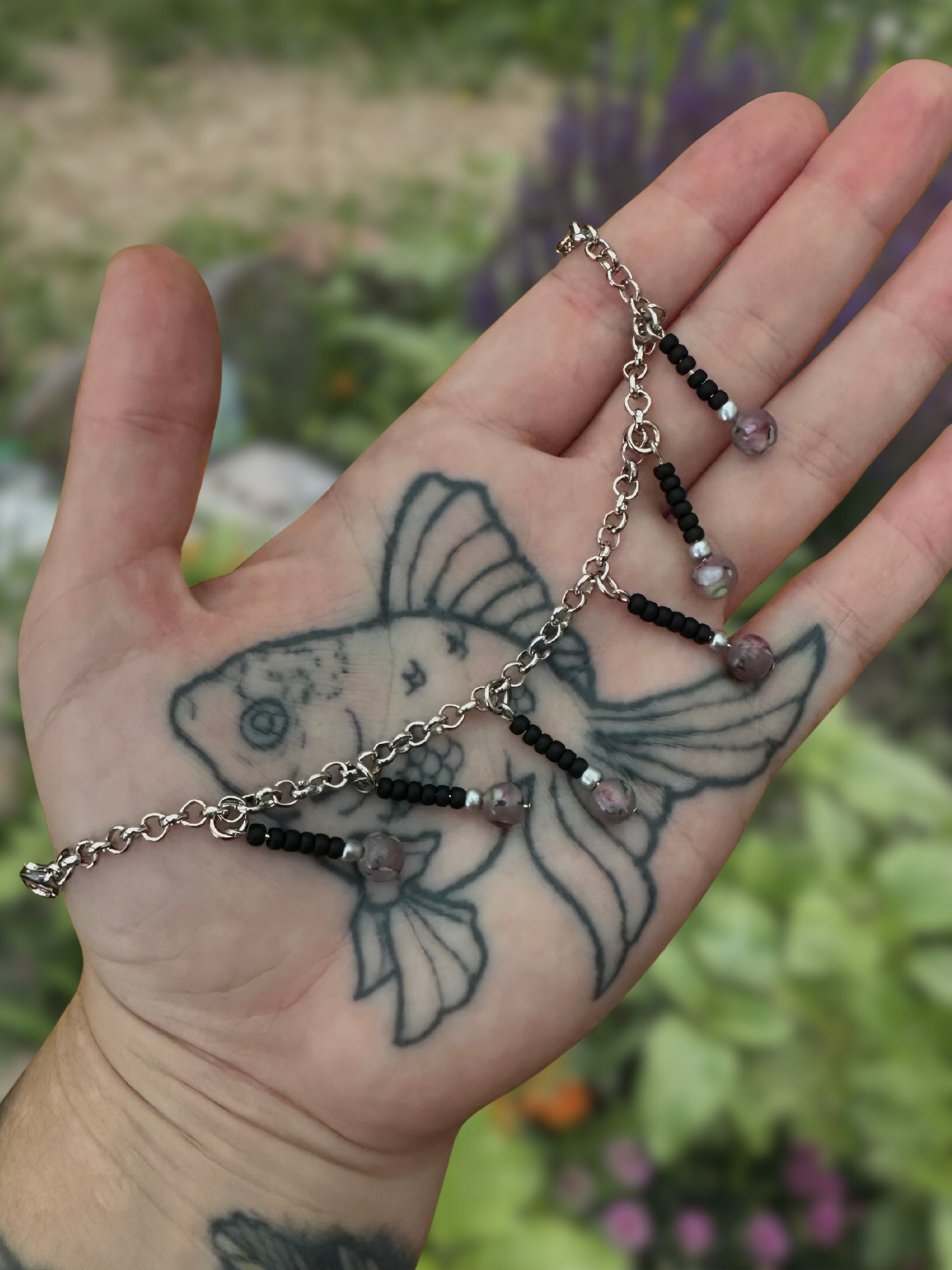 silver mask chain with black & purple dangly bits